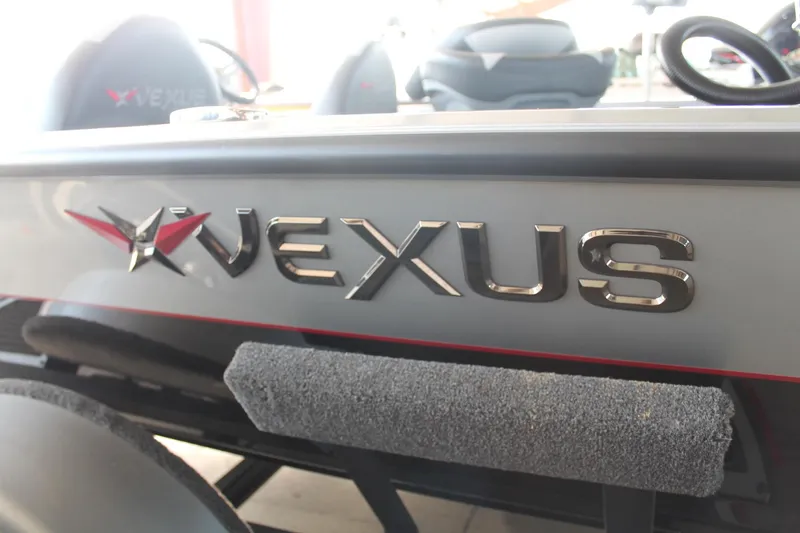 Slide: The Image of 2025 Vexus AVX1880 boat logo on sleek gray exterior. - 13