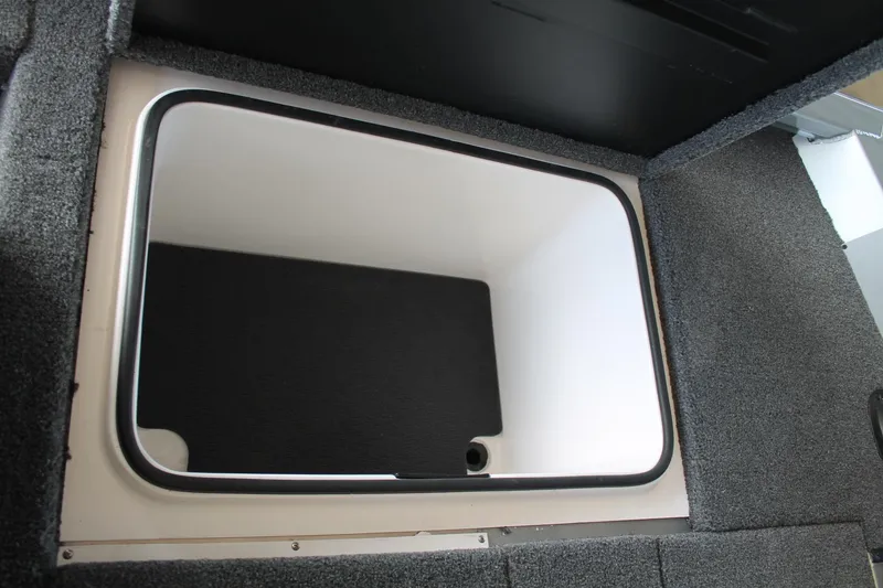 Slide: The Image of 2025 Vexus AVX1880 boat storage compartment with carpeted interior. - 21