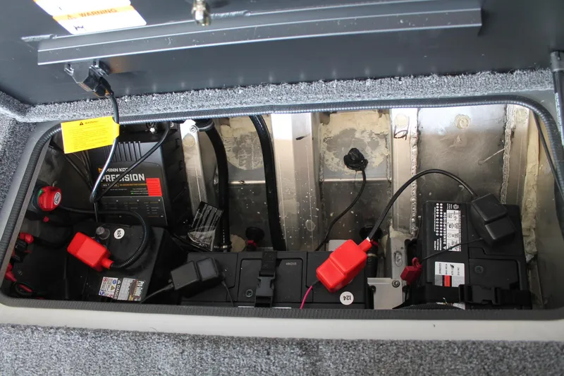 Slide: The Image of Battery compartment of 2025 Vexus AVX1880 boat with wiring and components. - 23