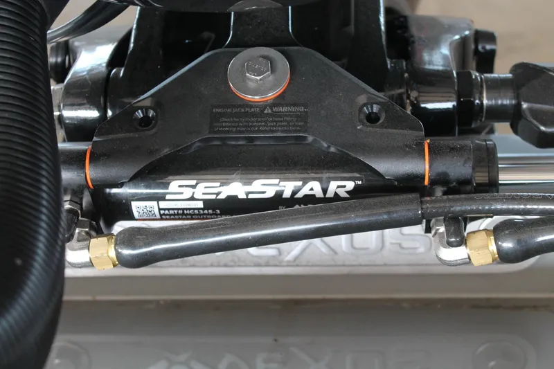 Slide: The Image of Close-up of SeaStar hydraulic steering on 2025 Vexus AVX1880 boat. - 24