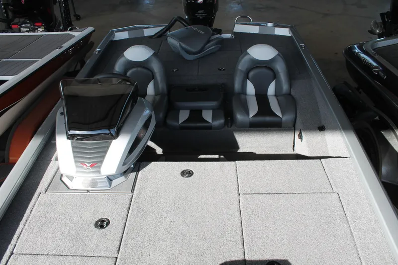 Slide: The Image of 2025 Vexus AVX1880 boat interior with dual seats and modern dashboard. - 6