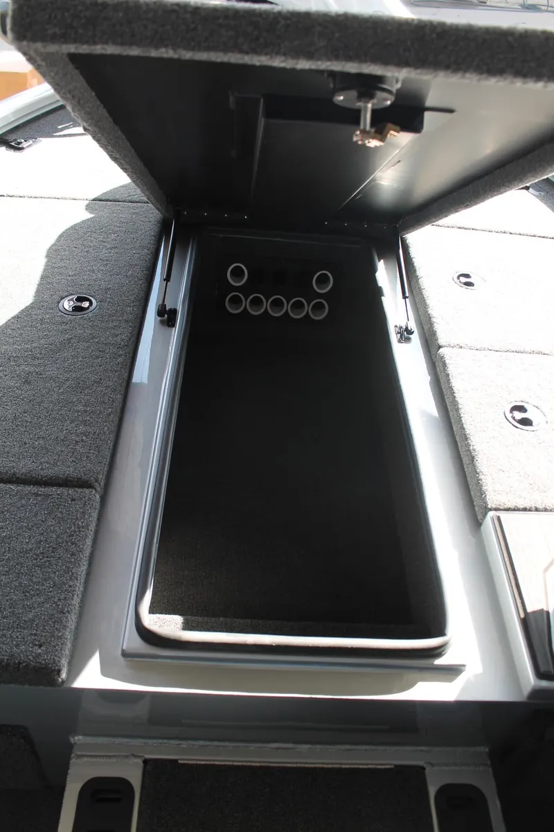 Slide: The Image of 2025 Vexus AVX1880 boat storage compartment with open lid. - 7