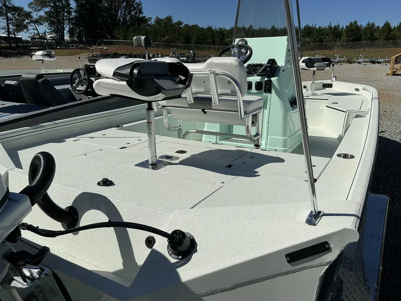 Slide: The Image of 2025 Excel Bay Pro 220 ELITE boat with spacious deck and modern seating. - 4