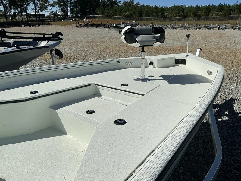 Slide: The Image of 2025 Excel Bay Pro 220 ELITE boat deck in a sunny outdoor setting. - 7