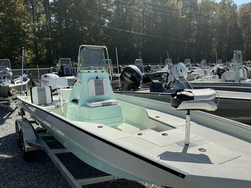 Slide: The Image of 2025 Excel Bay Pro 220 ELITE boat displayed in a marina setting. - 9