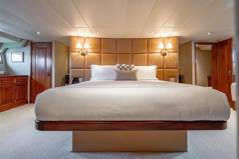 Slide: The Image of Luxurious bedroom interior of 2009 Custom Crystal Motoryacht with elegant wood accents and plush bedding. - 124