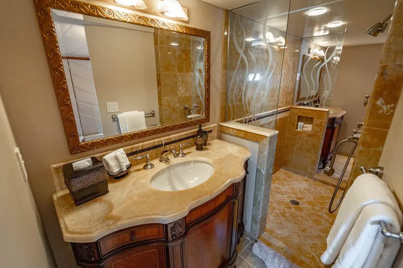 Slide: The Image of Luxurious bathroom on 2009 Custom Crystal Motoryacht with elegant marble sink and glass shower. - 128