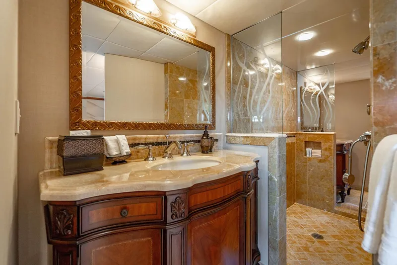Slide: The Image of Luxurious bathroom on 2009 Custom Crystal Motoryacht with elegant wood vanity and glass shower. - 129