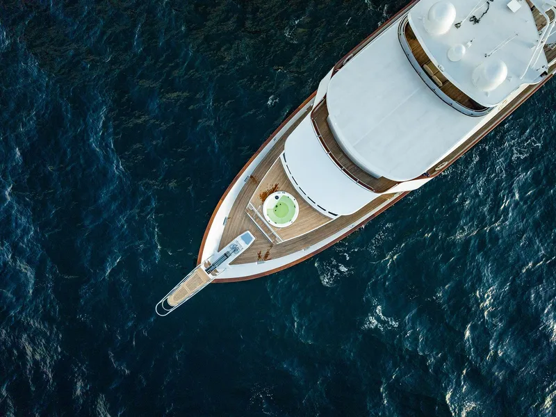 Slide: The Image of Aerial view of a 2009 Custom Crystal Motoryacht on open sea. - 25