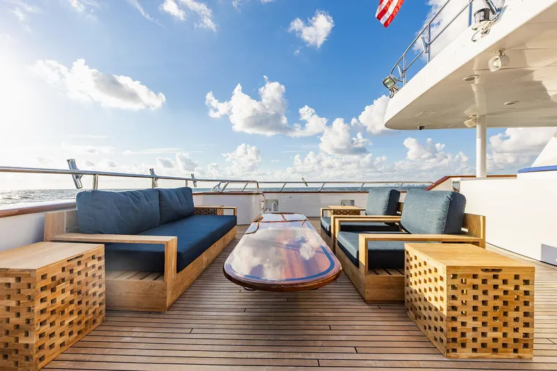 Slide: The Image of Luxurious deck of 2009 Crystal Motoryacht with stylish wooden furniture. - 37