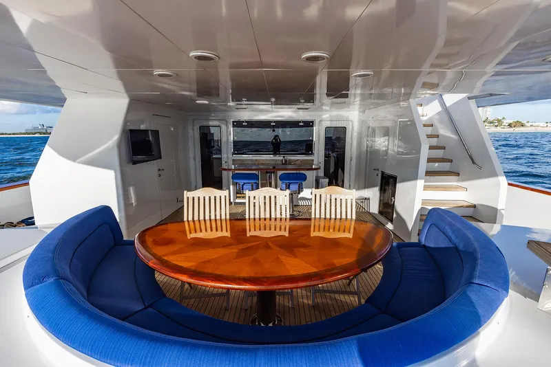 Slide: The Image of Luxurious dining area on 2009 Crystal Motoryacht with blue upholstery. - 42
