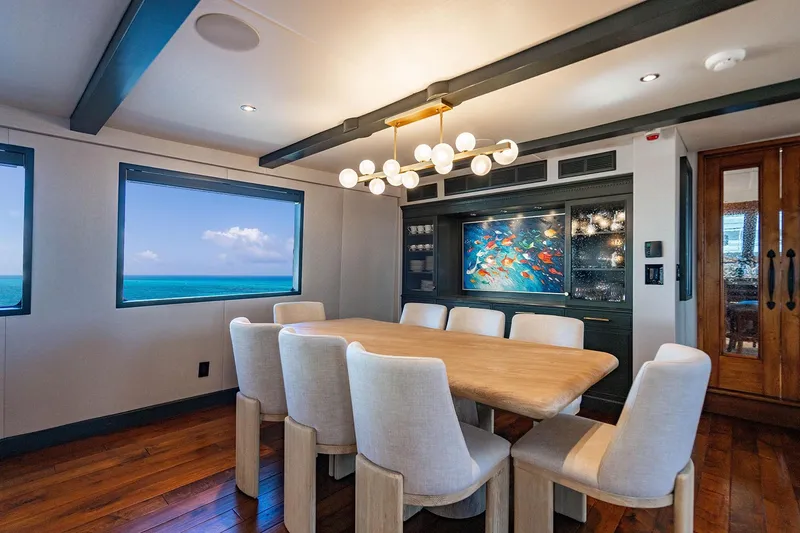 Slide: The Image of Luxurious dining area on 2009 Custom Crystal Motoryacht with ocean view and modern decor. - 86