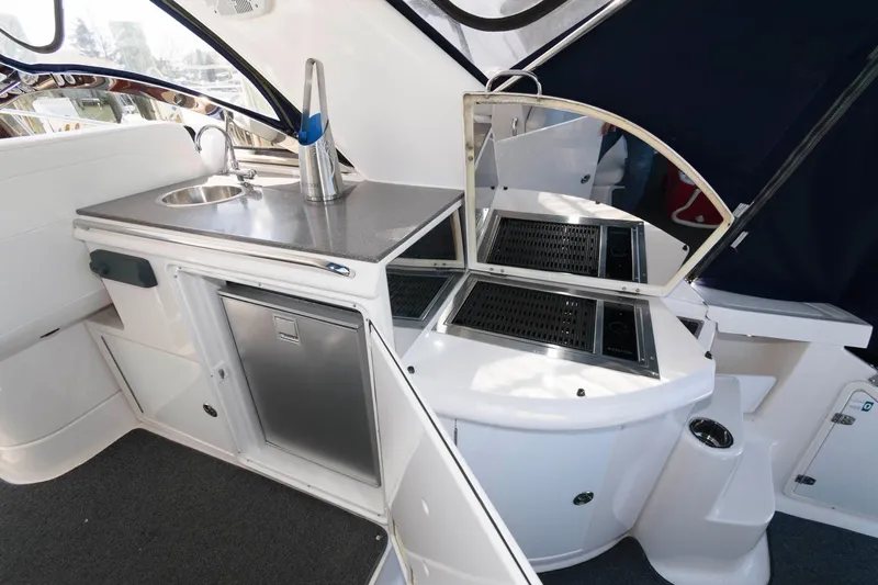 Slide: The Image of 2006 Regal 4460 Commodore yacht interior with kitchenette and stainless steel sink. - 10