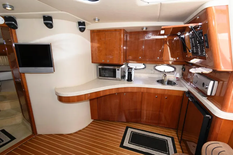 Slide: The Image of Luxurious 2006 Regal 4460 Commodore yacht interior with modern kitchen amenities. - 17