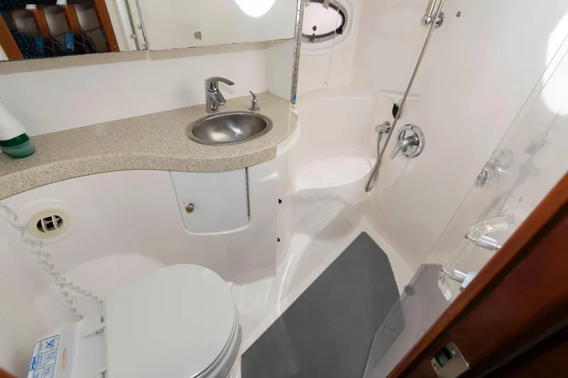 Slide: The Image of 2006 Regal 4460 Commodore yacht bathroom with sink, toilet, and shower. - 20