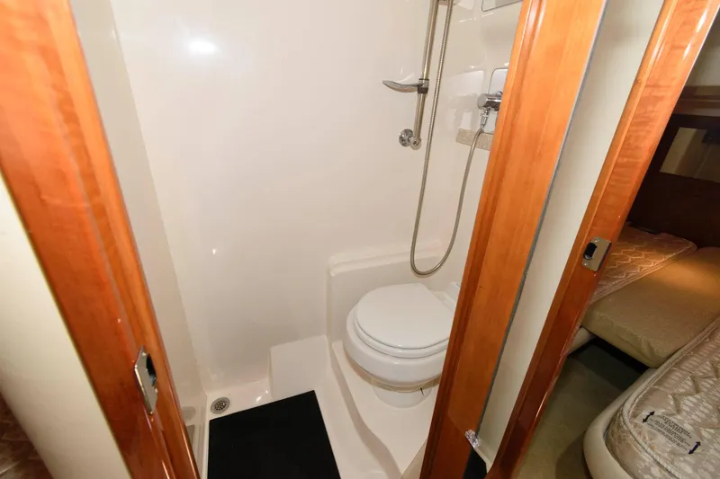Slide: The Image of 2006 Regal 4460 Commodore yacht bathroom with shower and toilet. - 22