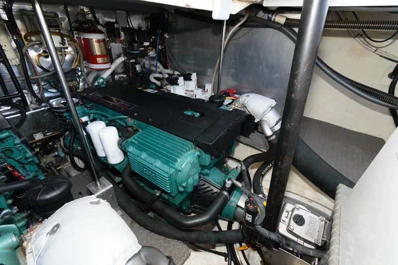 Slide: The Image of Engine room of 2006 Regal 4460 Commodore with visible machinery and components. - 25