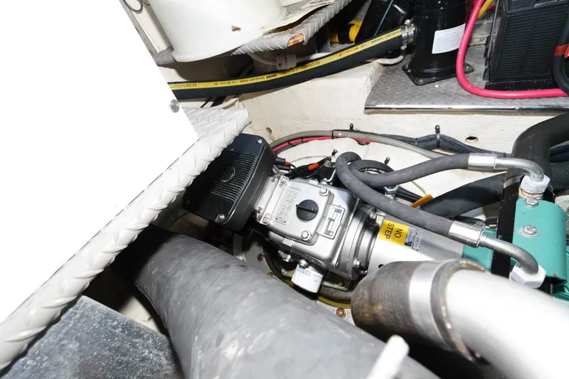 Slide: The Image of Engine compartment of 2006 Regal 4460 Commodore with visible components and wiring. - 28