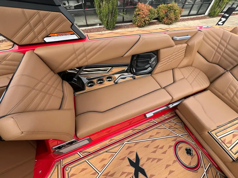 Slide: The Image of Luxurious interior of 2025 Tigé 25ZX Ultre' boat with tan leather seating and stylish design. - 10