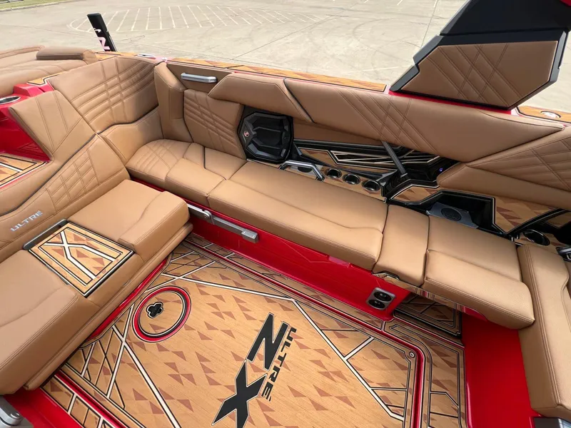 Slide: The Image of Luxurious interior of 2025 Tigé 25ZX Ultre' boat with tan leather seating. - 11