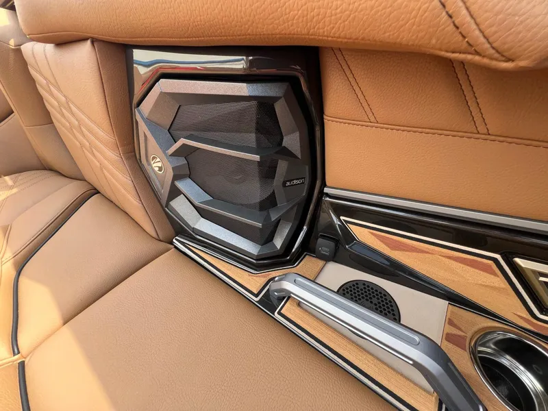 Slide: The Image of 2025 Tigé 25ZX Ultre' interior with premium Audison speaker and luxurious tan leather seating. - 12