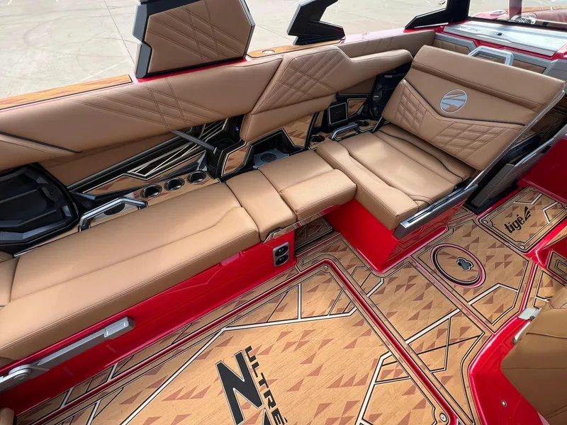 Slide: The Image of Luxurious interior of 2025 Tigé 25ZX Ultre' boat with tan leather seating and stylish flooring. - 13