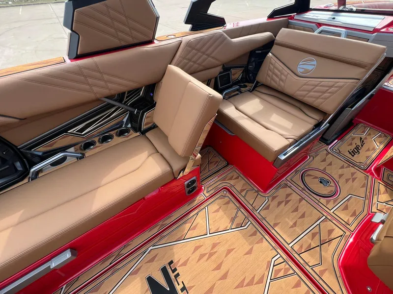 Slide: The Image of Luxurious interior of 2025 Tigé 25ZX Ultre' boat with tan seats and stylish flooring. - 14