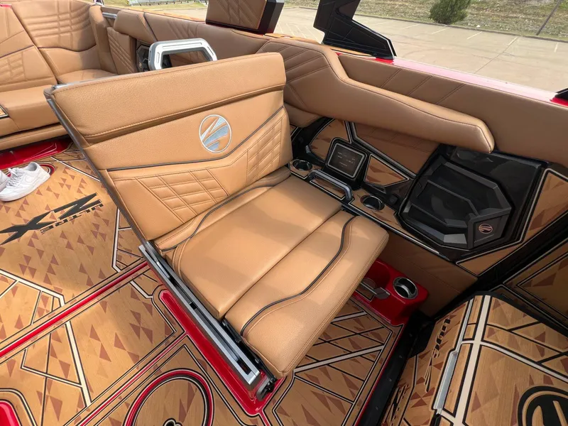 Slide: The Image of Luxurious interior of 2025 Tigé 25ZX Ultre' boat with tan leather seating. - 15