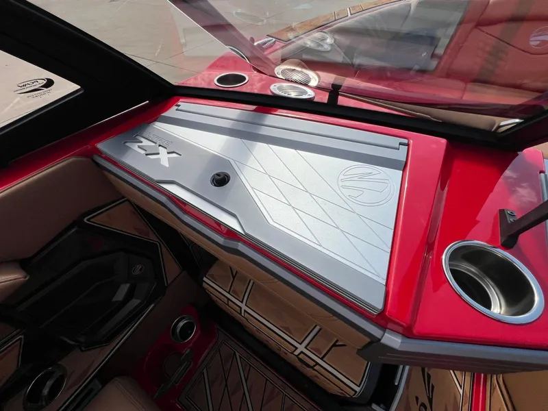 Slide: The Image of 2025 Tigé 25ZX Ultre' boat dashboard with sleek red and silver design. - 18