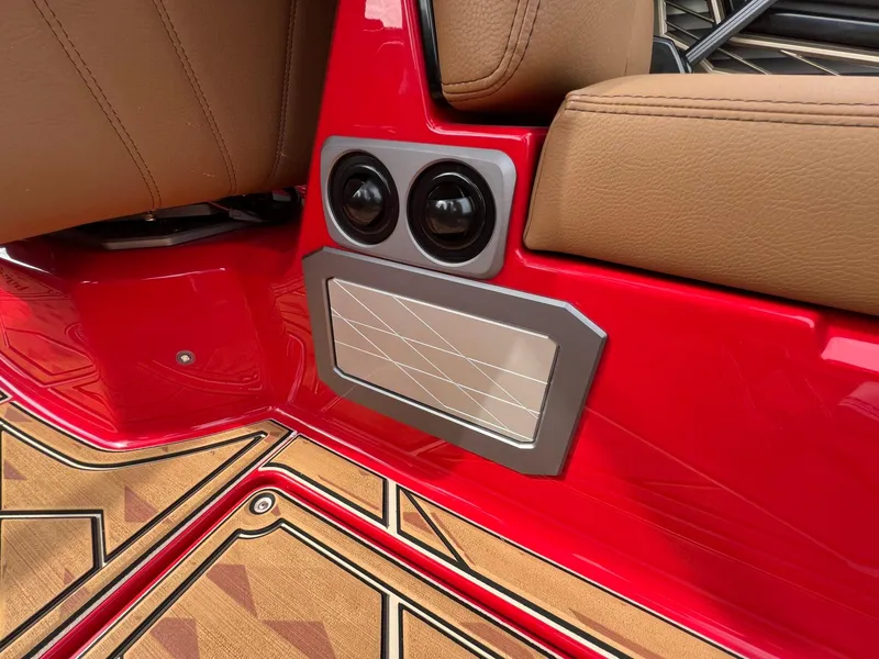 Slide: The Image of 2025 Tigé 25ZX Ultre' interior with red accents and tan seating. - 21