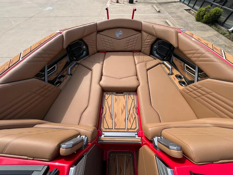 Slide: The Image of Luxurious interior of 2025 Tigé 25ZX Ultre' boat with tan leather seating. - 25