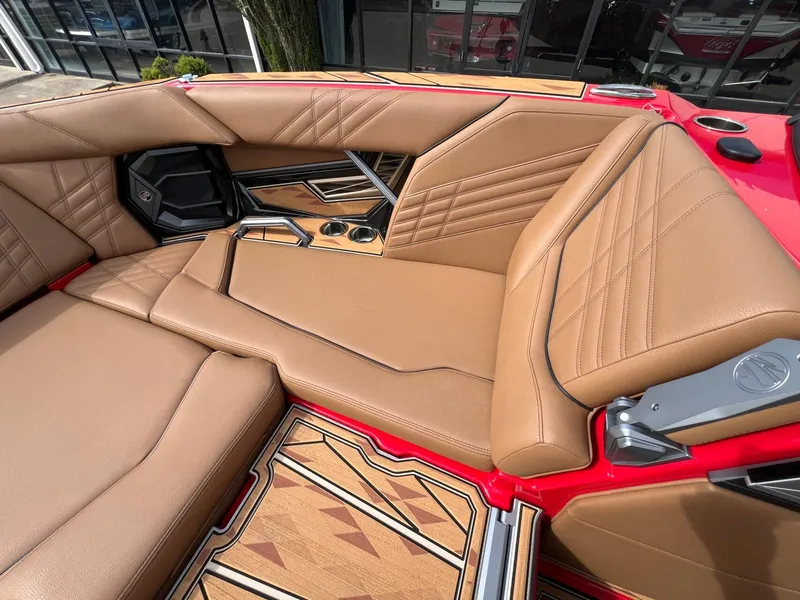 Slide: The Image of 2025 Tigé 25ZX Ultre' boat interior with tan leather seats and modern design. - 26
