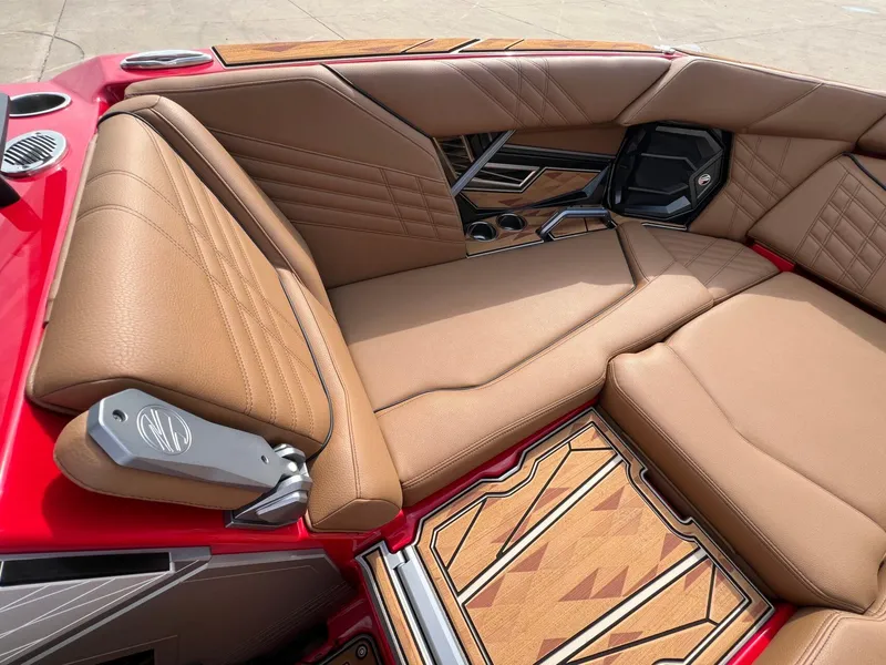 Slide: The Image of Luxurious interior of 2025 Tigé 25ZX Ultre' boat with tan leather seating. - 27