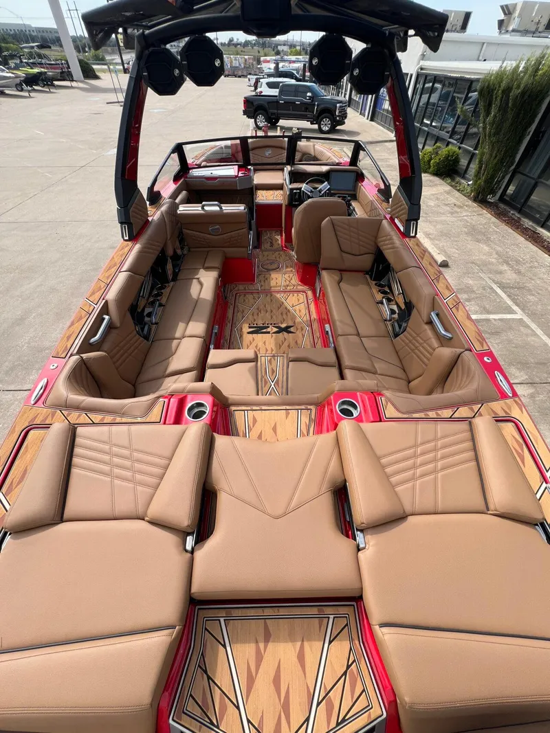 Slide: The Image of 2025 Tigé 25ZX Ultre' boat interior with luxurious tan seating and modern design. - 8
