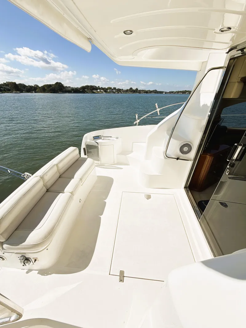 Slide: The Image of Azimut 42 yacht 2002 model, spacious deck overlooking serene waters. - 21