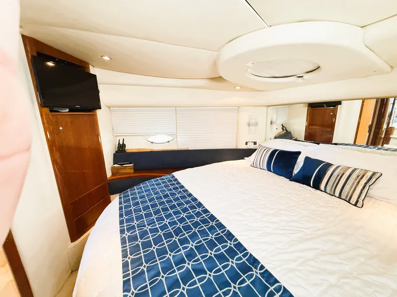 Slide: The Image of Luxurious bedroom interior of 2002 Azimut 42 yacht with modern decor. - 28