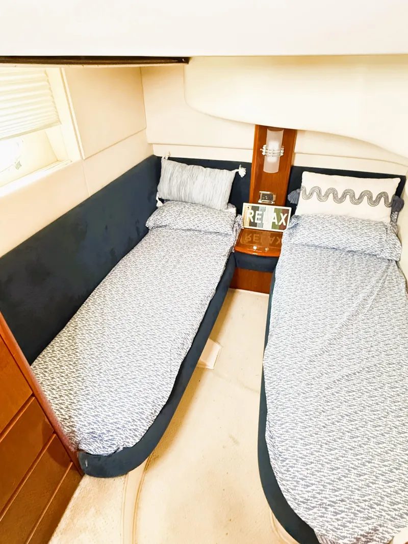 Slide: The Image of Cozy twin cabin in 2002 Azimut 42 yacht with stylish bedding. - 29