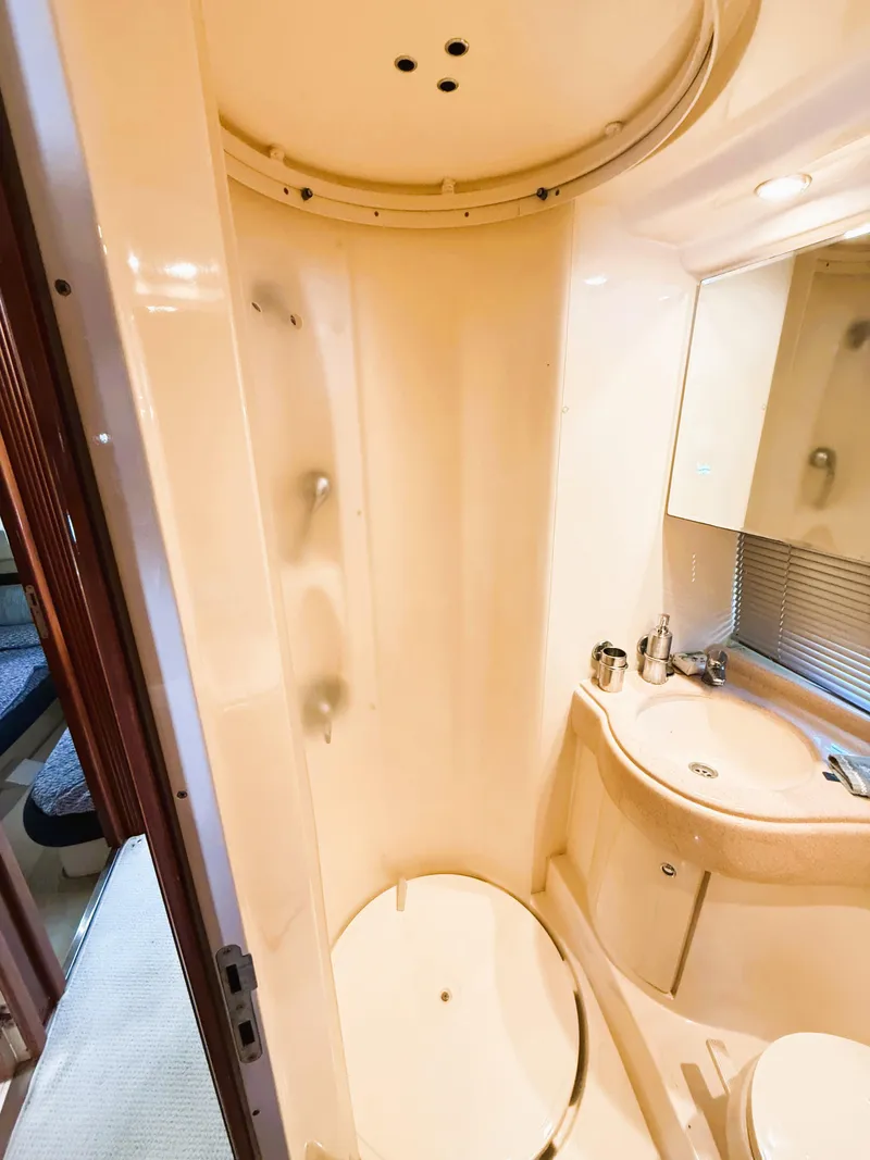 Slide: The Image of 2002 Azimut 42 yacht bathroom with shower, sink, and mirror. - 30