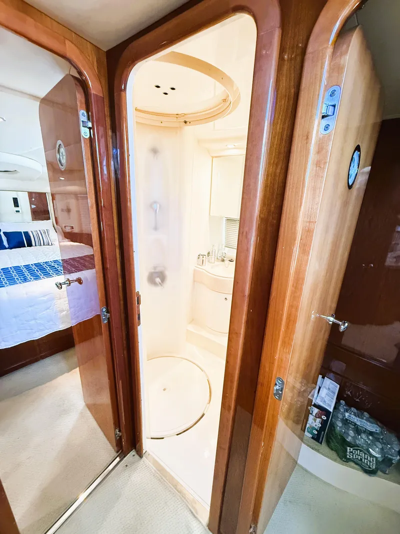Slide: The Image of 2002 Azimut 42 yacht interior with bathroom and bedroom view. - 32
