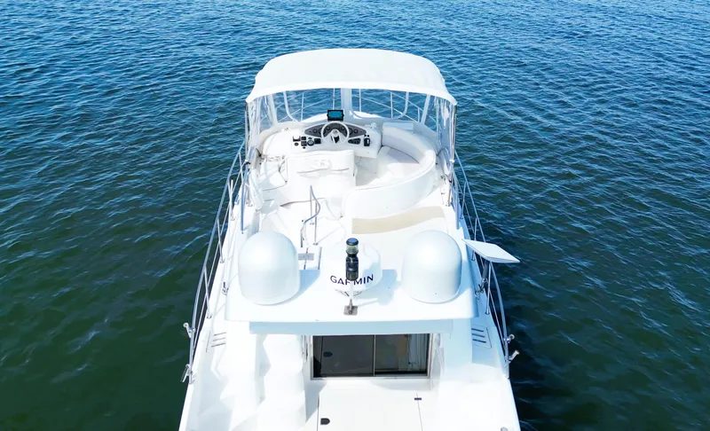 Slide: The Image of Azimut 42 yacht, 2002 model, cruising on open water, aerial view. - 4