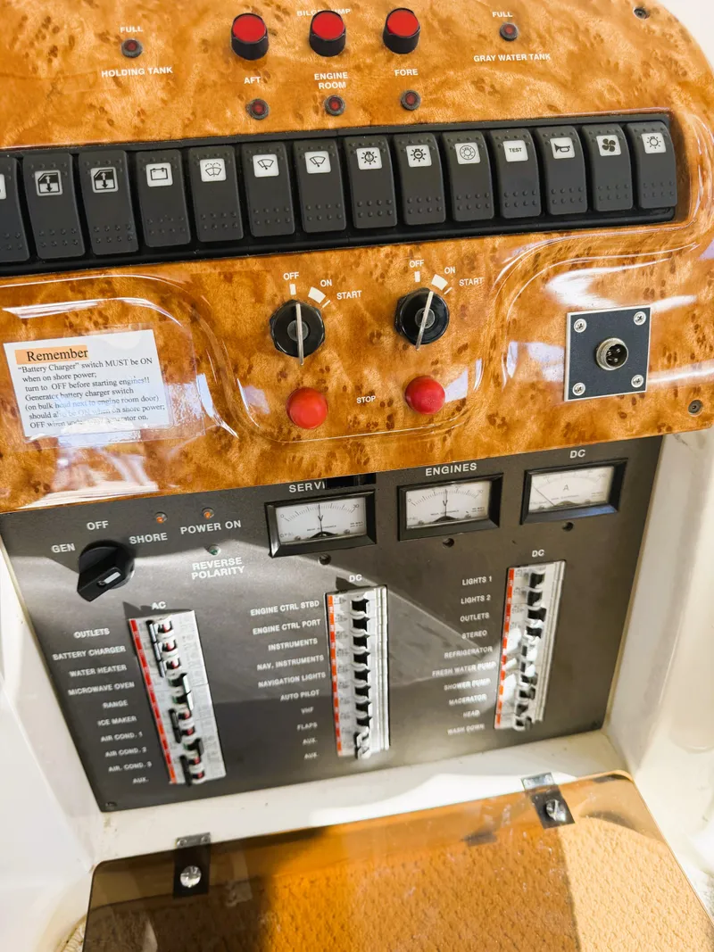 Slide: The Image of Control panel of a 2002 Azimut 42 yacht with switches and gauges. - 40