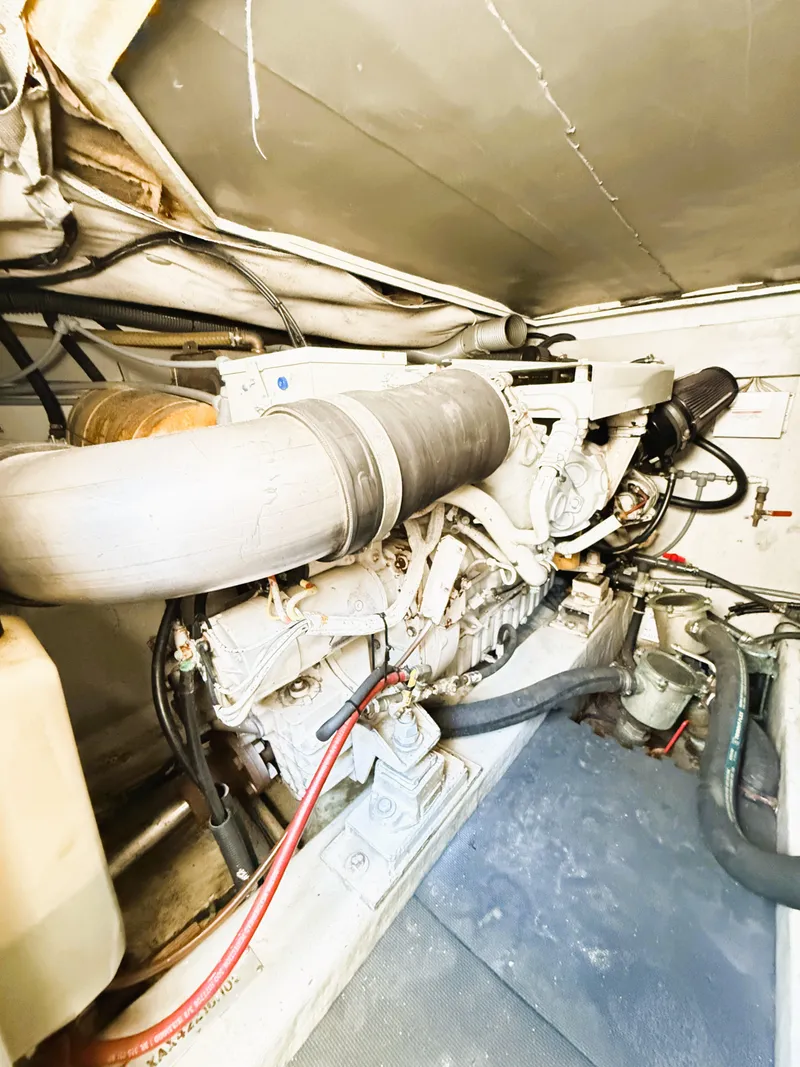 Slide: The Image of Engine room of 2002 Azimut 42 yacht, showcasing mechanical components and piping. - 41