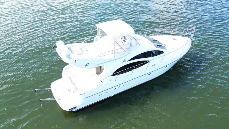 Slide: The Image of 2002 Azimut 42 yacht on calm water, aerial view. - 7