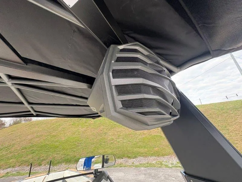 Slide: The Image of 2025 Nautique G25 boat speaker under canopy, showcasing modern design. - 10