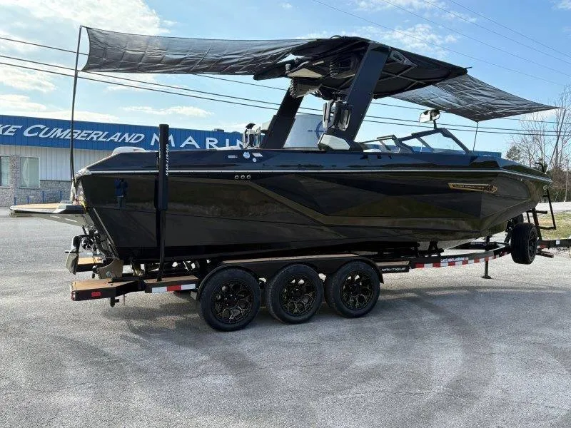 Slide: The Image of 2025 Nautique G25 boat on trailer at Lake Cumberland Marina. - 125