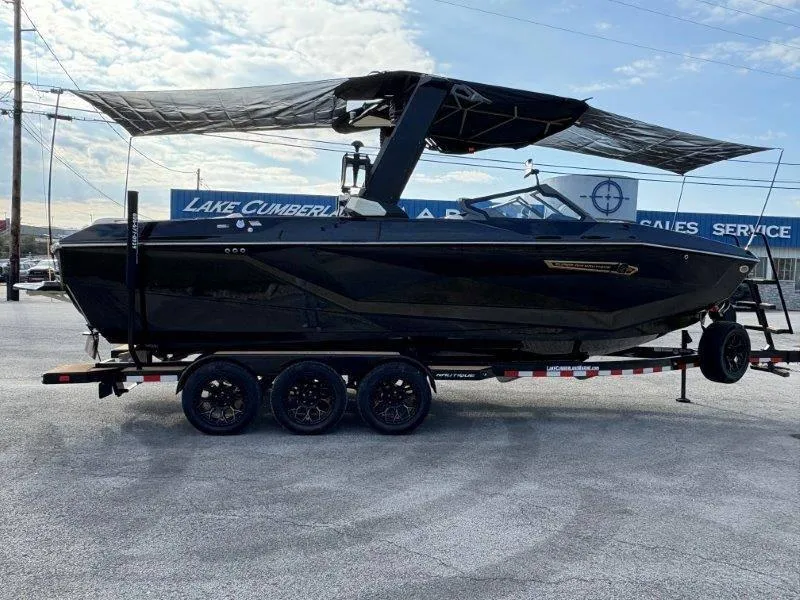 Slide: The Image of 2025 Nautique G25 boat on trailer at Lake Cumberland Marine. - 128