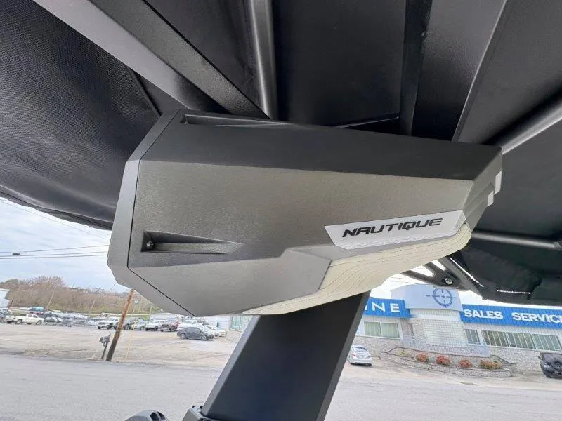 Slide: The Image of Close-up of 2025 Nautique G25 boat speaker under canopy. - 18