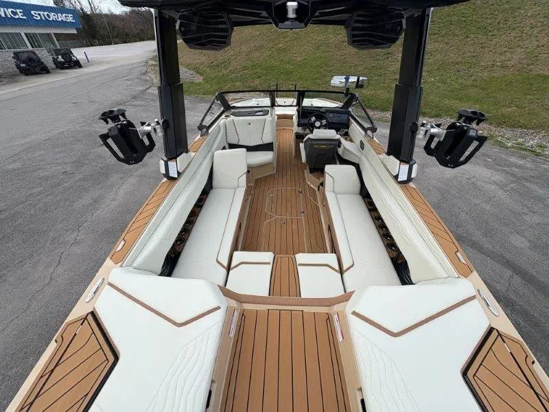Slide: The Image of 2025 Nautique G25 boat interior with luxurious seating and sleek design. - 19