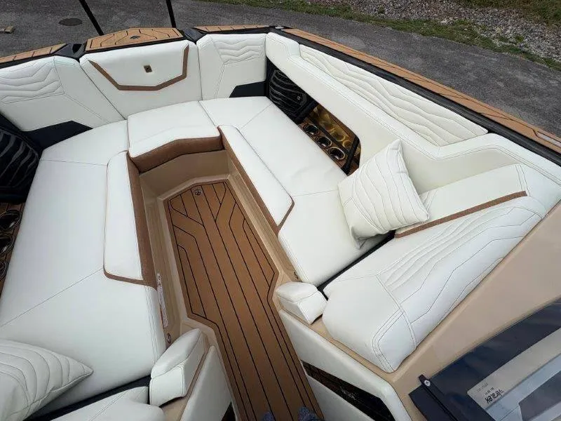 Slide: The Image of Luxurious interior of 2025 Nautique G25 boat with white leather seating. - 20