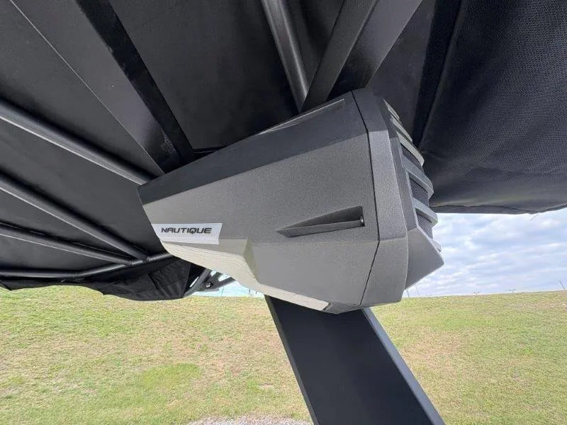 Slide: The Image of Close-up of 2025 Nautique G25 boat speaker under black canopy. - 22